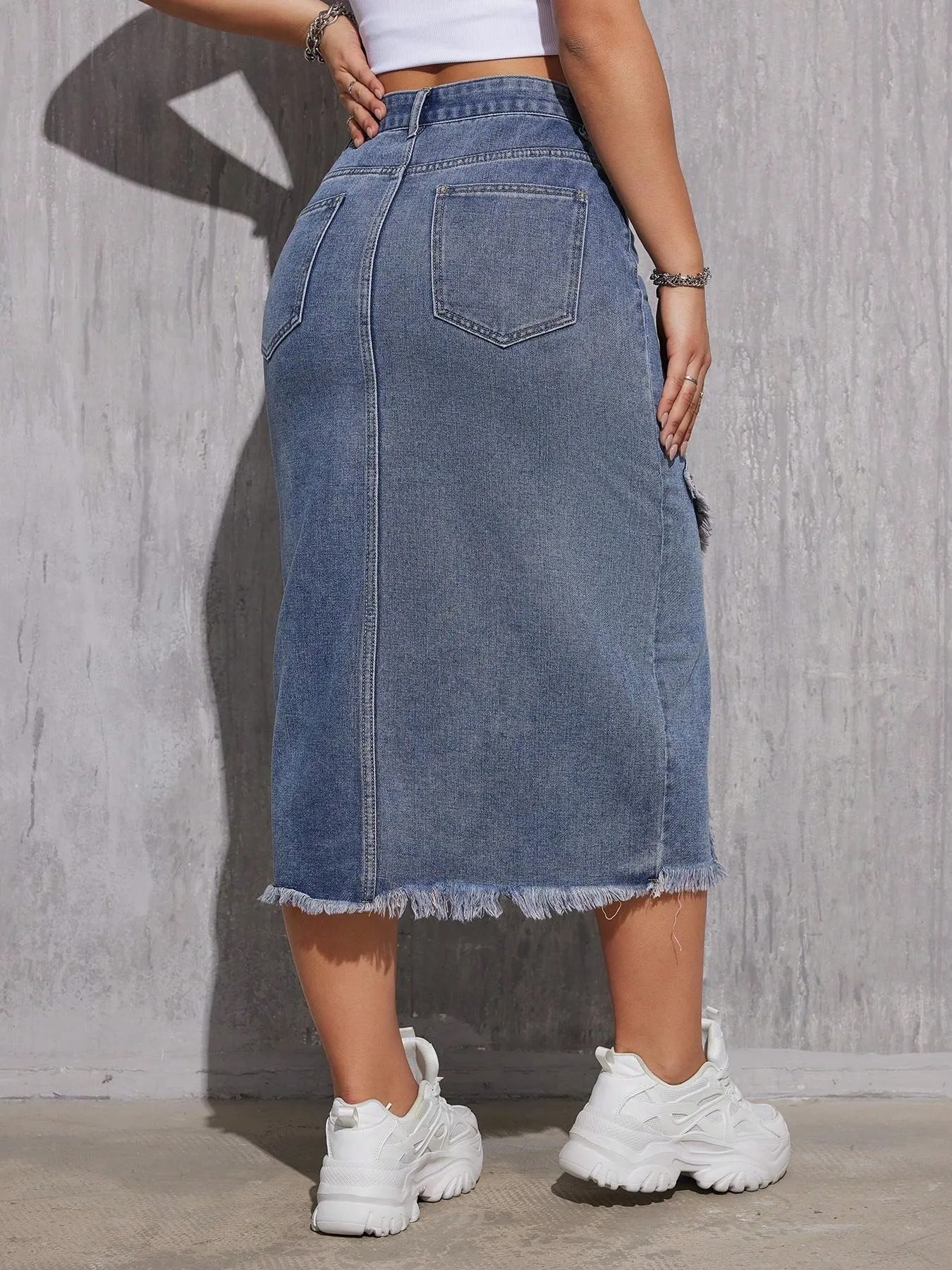 Falda midi de mezclilla con flecos